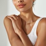 woman-with-white-tank-top-that-says-lg-chest